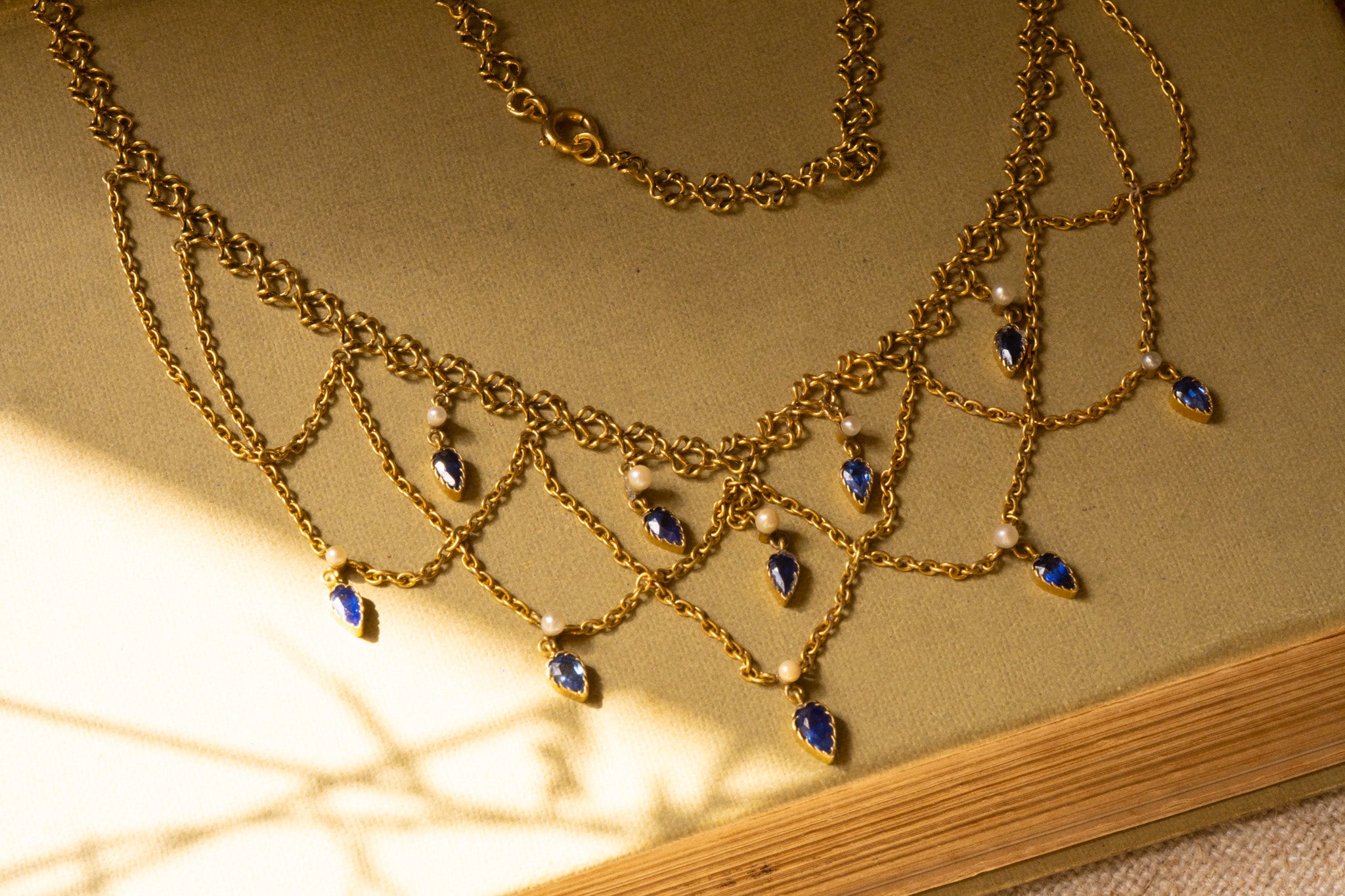 French Belle Époque festoon swag necklace in 18ct gold with Sapphires and Pearls